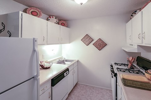the preserve at ballantyne commons apartment kitchen with white appliances and white cabinets