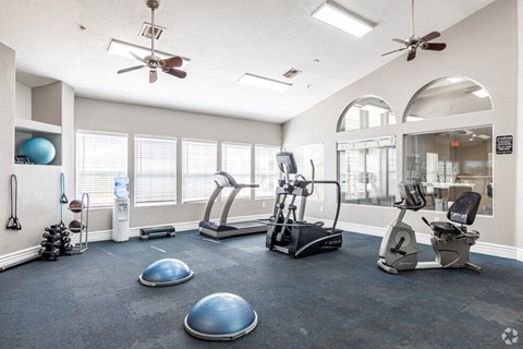 the gym at the district flats apartments in lenexa