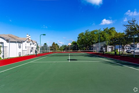a tennis court with a red and green court