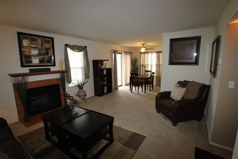 a living room with a couch and a fireplace
