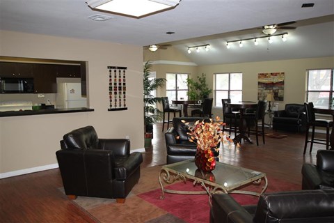 a living room with leather furniture and a table