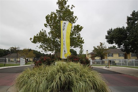 a yellow sign in the middle of a street