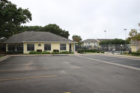 an empty parking lot in front of a building