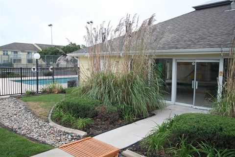 a backyard with a pool and a house