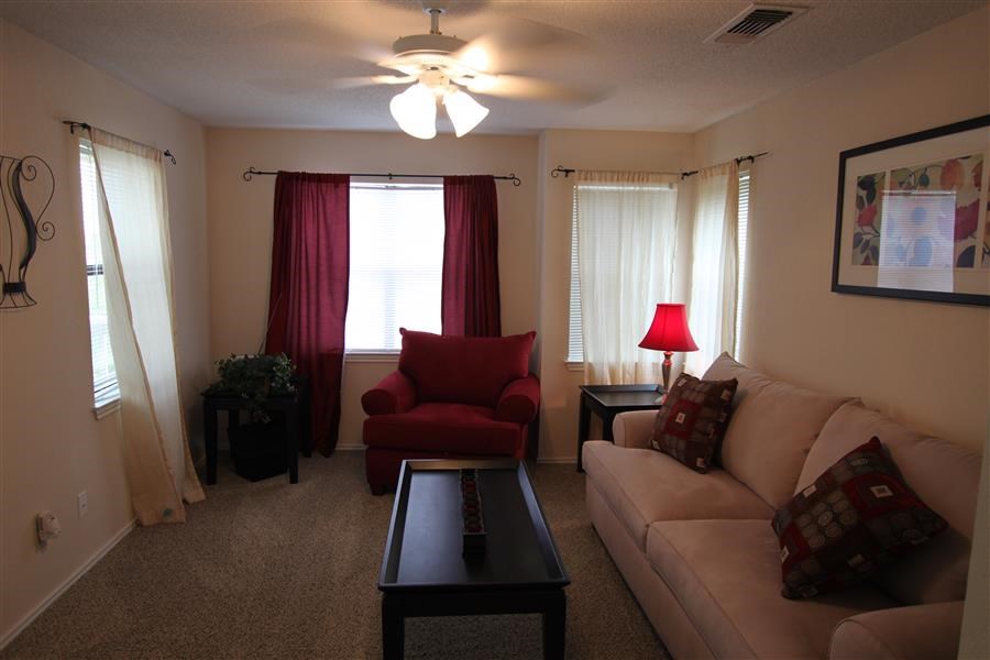 a living room with a couch and a table