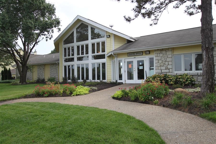 a house with a walkway in front of it