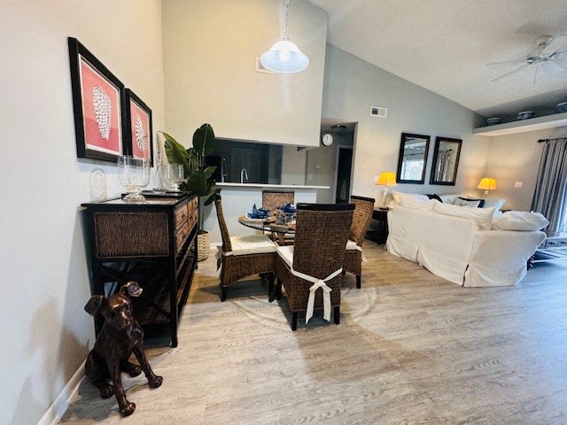 a living room filled with furniture and a dog