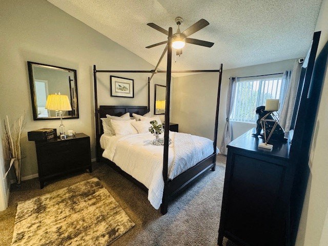 a bedroom with a bed and a ceiling fan