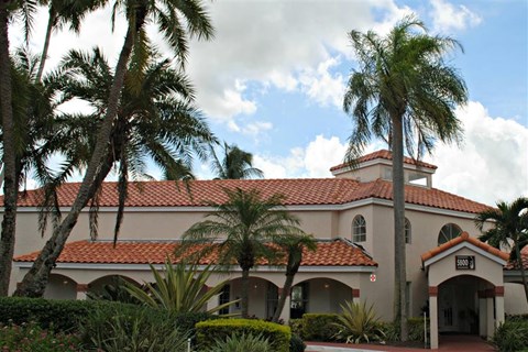 a building with palm trees in front of it