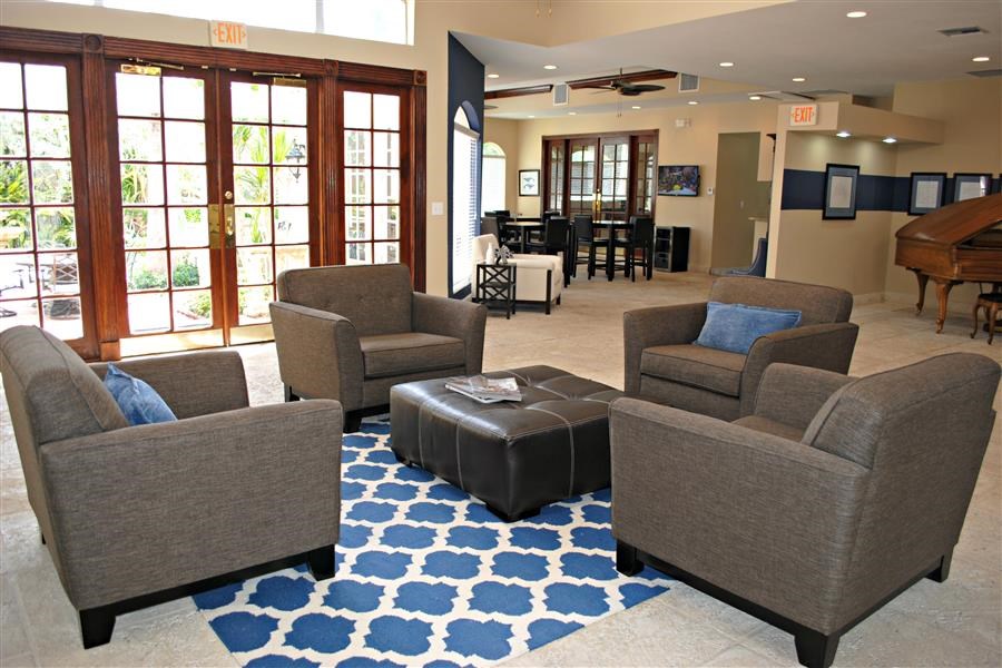 a living room with couches and chairs and a coffee table