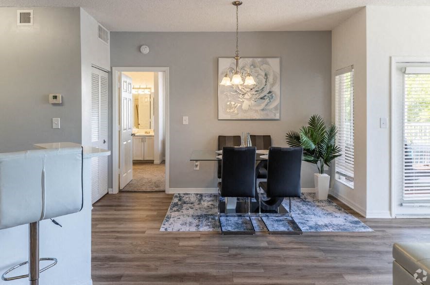 a dining room with a table and chairs