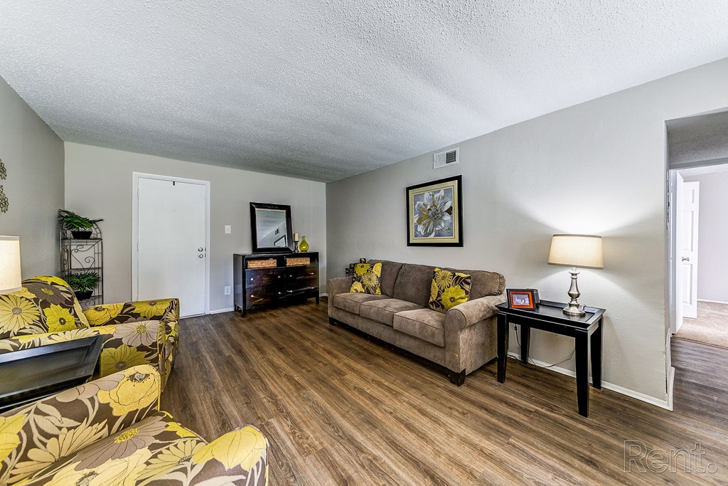 a living room with couches and a table