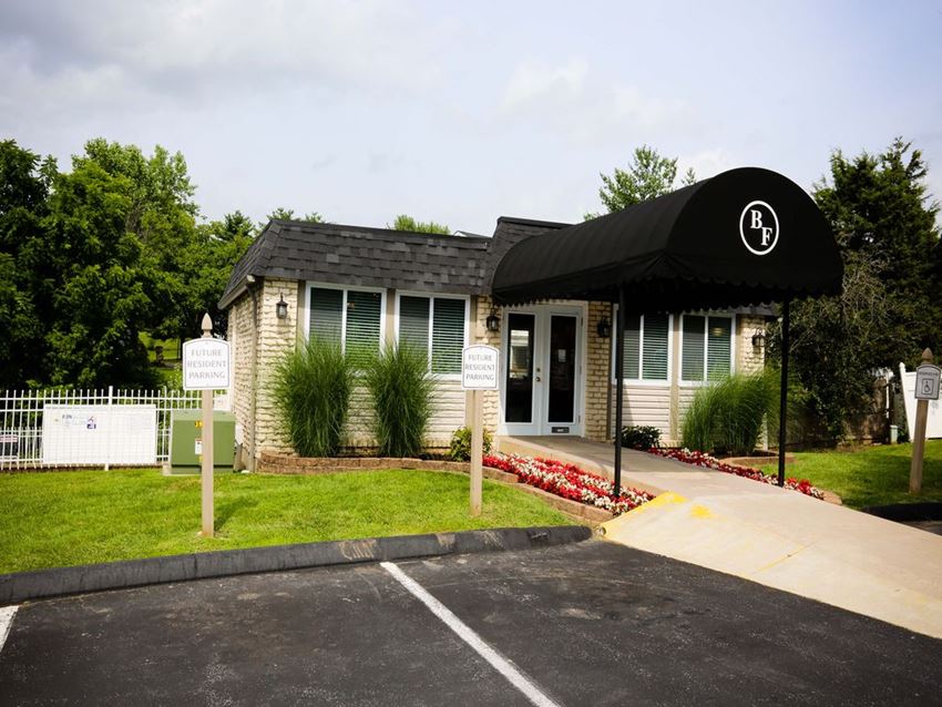 the front of a house with a black awning