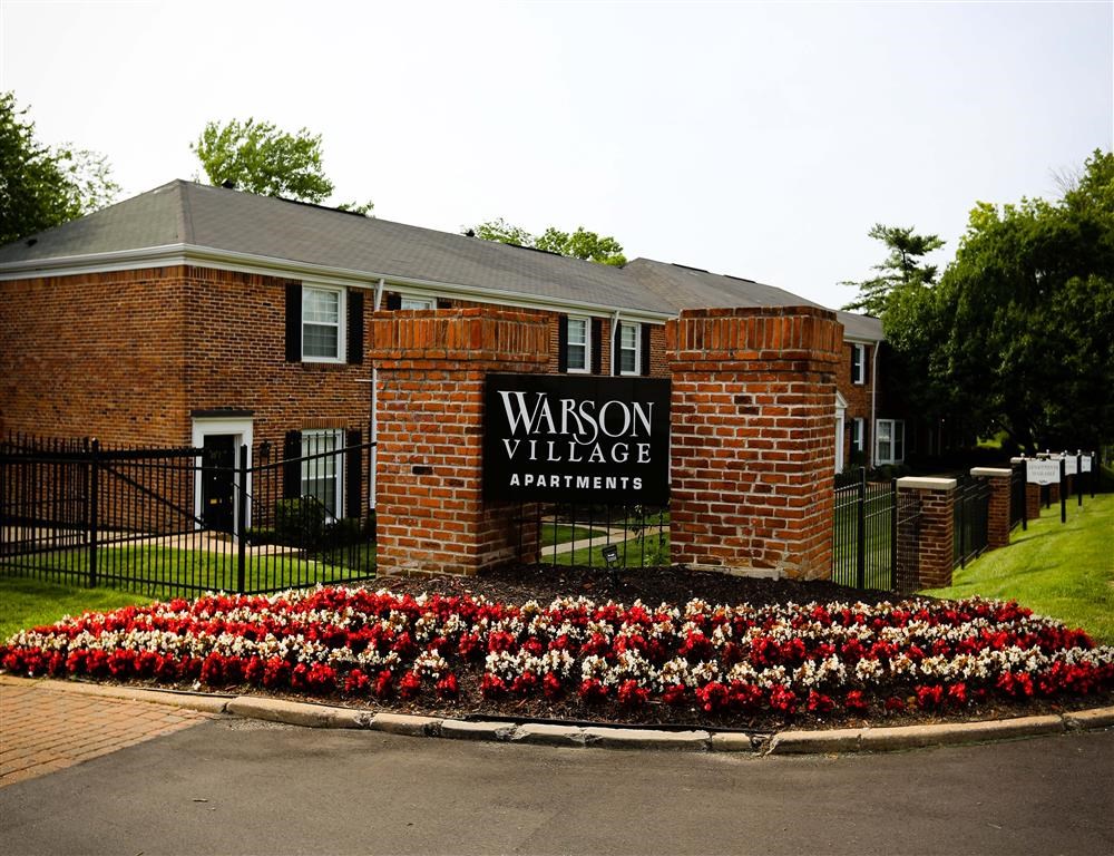 the sign in front of the warden village apartments