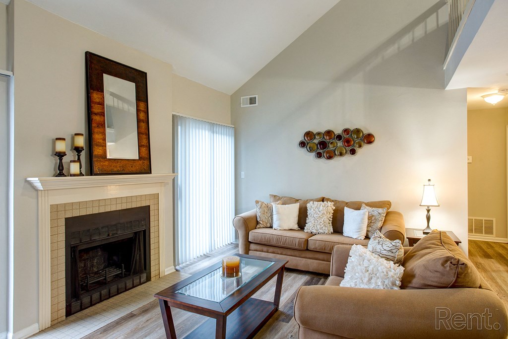 a living room with a couch and a fireplace