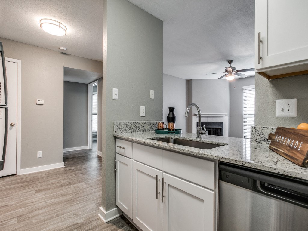 the kitchen and living room in a new home