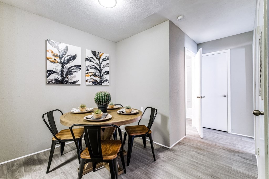 our apartments offer a dining room with a table and chairs
