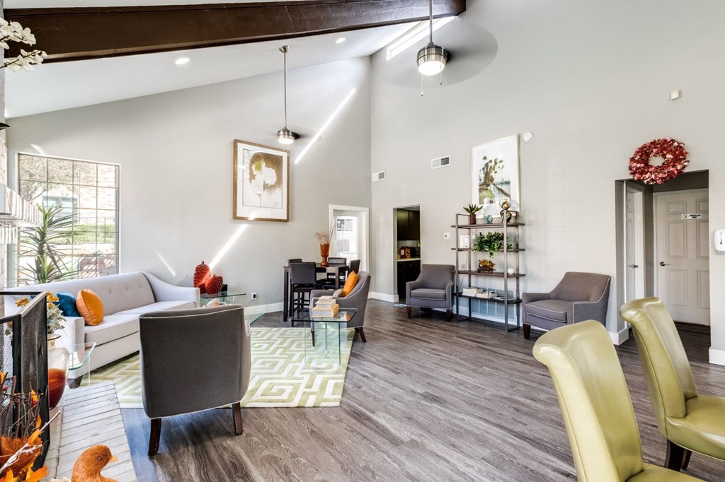 a living room with couches and chairs and a table