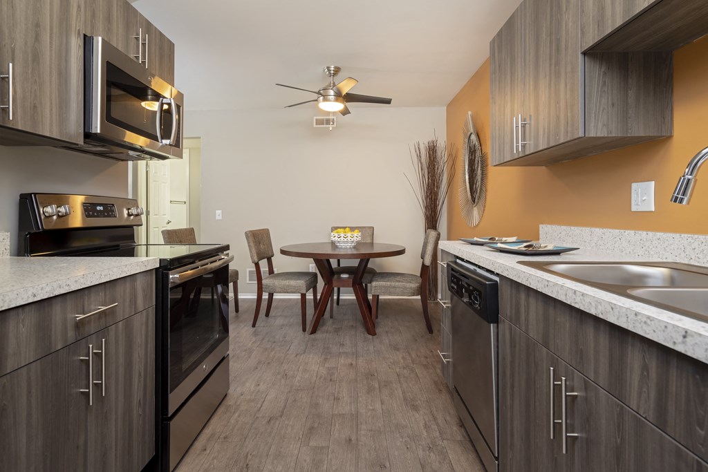kitchen and dining area at the preserve at polo ridge apartments in swords tx