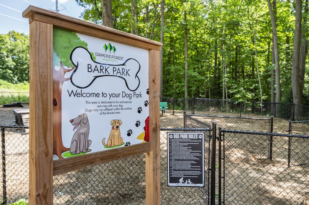 a sign that says bark park welcome to your dog park
