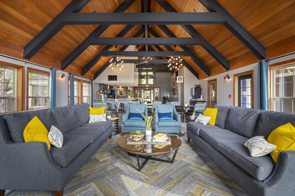 a large living room with couches and a coffee table