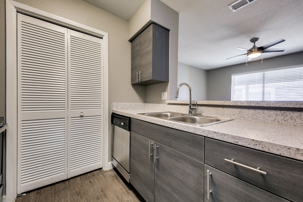 the kitchen of a home with stainless steel appliances and a sink