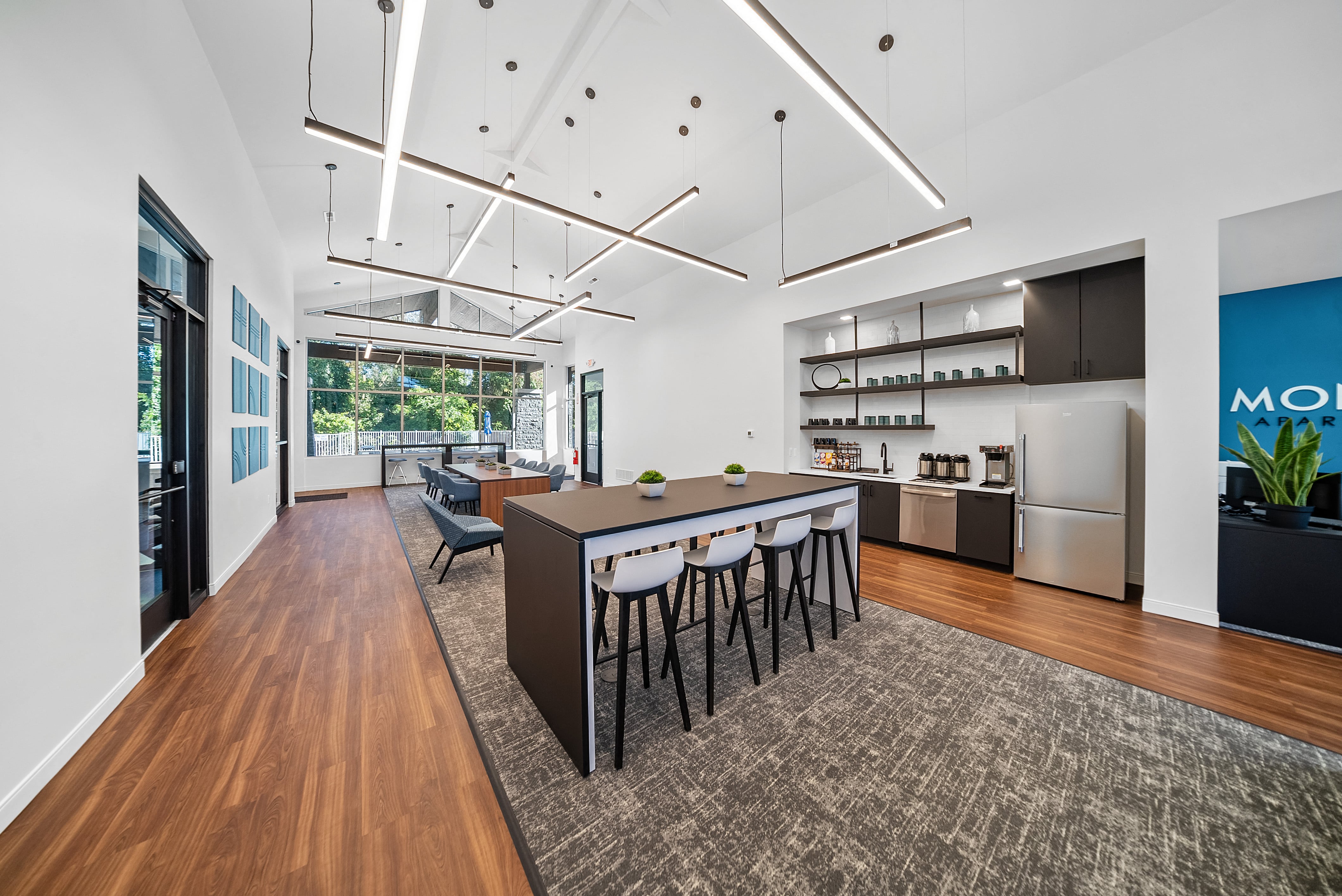 a large room with a kitchen and a dining table