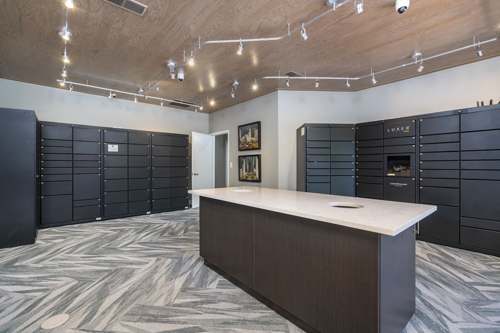 a large room with a counter top and a bunch of lockers