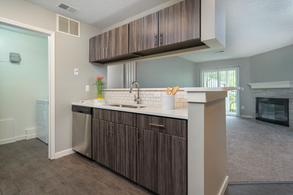 a kitchen with a counter top and a fireplace