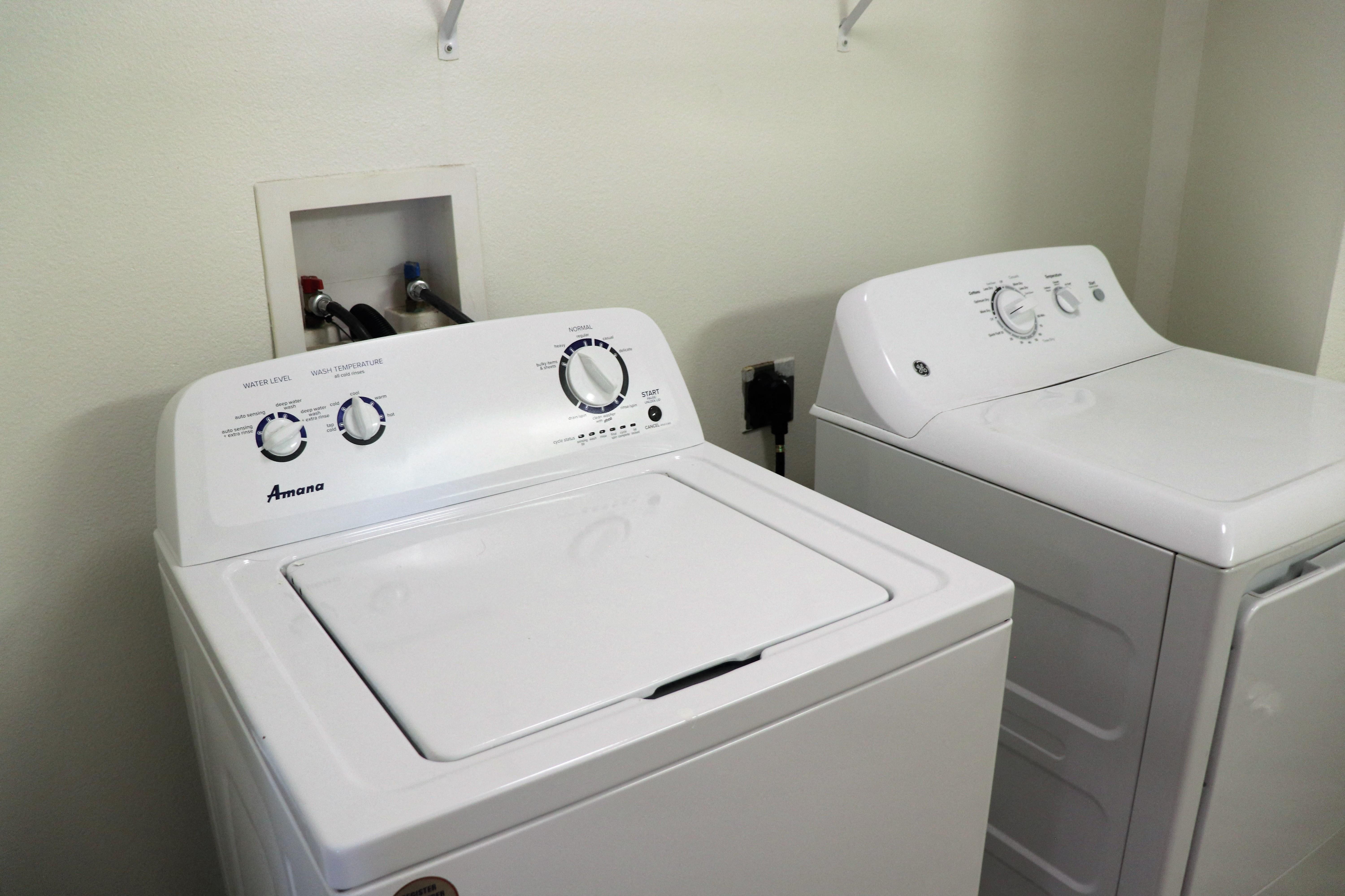 a washer and dryer are available in the laundry room