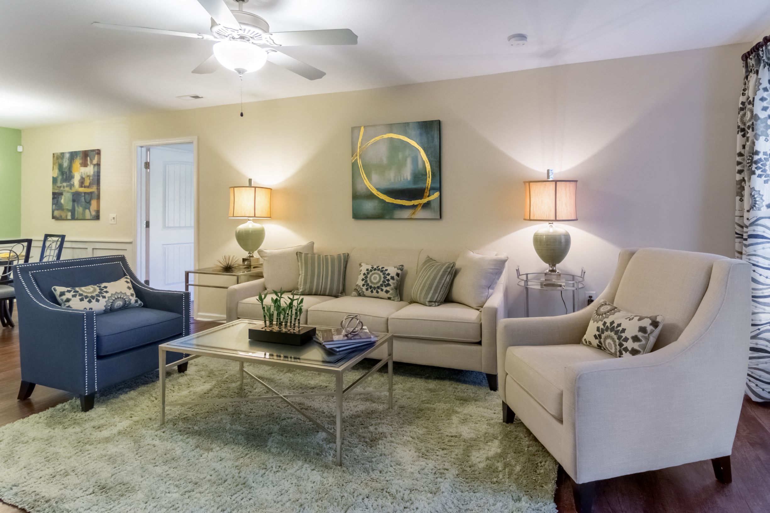 a living room with couches and chairs and a coffee table