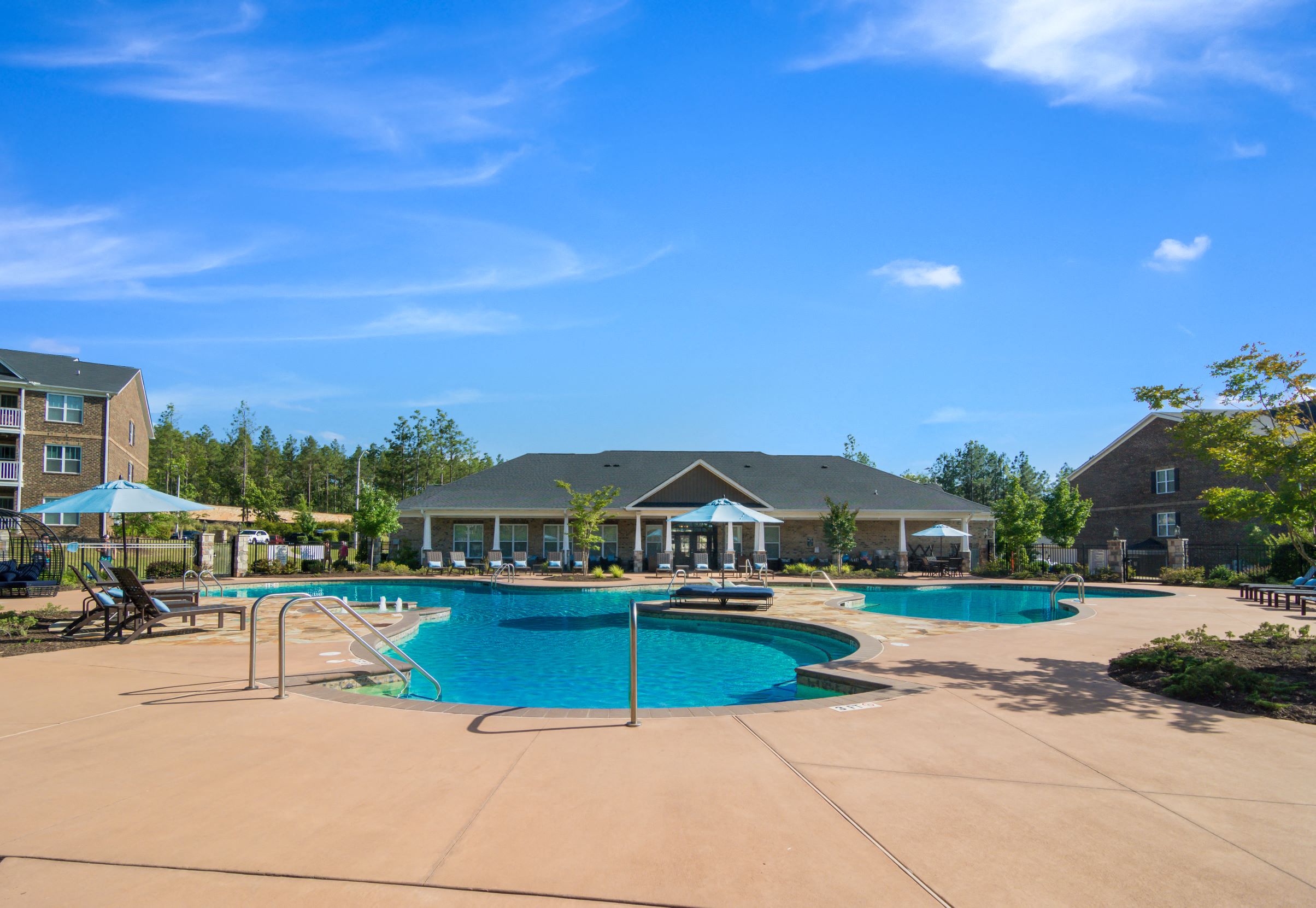 a swimming pool with a building in the background