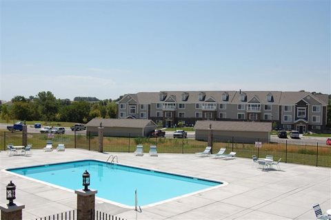 Swimming Pool With Sparkling Water at Colonial Pointe at Fairview Apartments, Bellevue, Nebraska