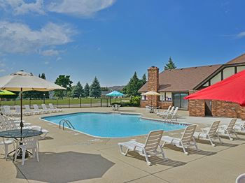 Outdoor pool with sundeck at Thornridge Apartments in Grand Blanc, Michigan