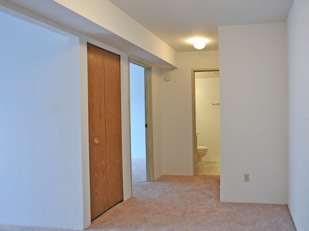 Hallway with Carpeting at Charter Oaks Apartments, Davison, MI, 48423