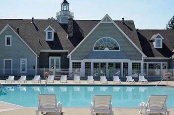 Scenic Seasonal Outdoor Swimming Pool with Sundeck and Lakeview at The Landings Apartments, Westland, Michigan