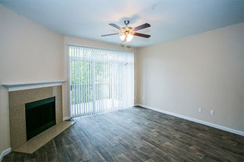 Faux Wood Floors in Spacious Floorplans with Ceiling Fan and Fireplace at Portland Townhome