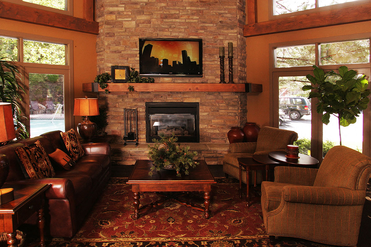 a living room with a couch and a fireplace