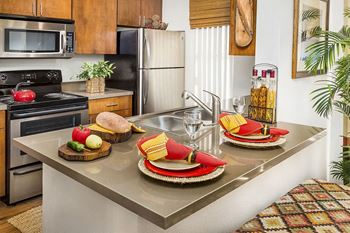 Apartments Near Cottonwood Mall with Kitchen Island and Upgraded Quartz Countertop