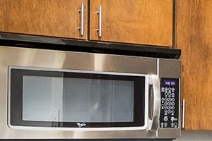 Pinnacle Highland Apartments Kitchen with Stainless Steel Appliances Kitchen with Stainless Steel Appliances at Midvale UT Apartments
