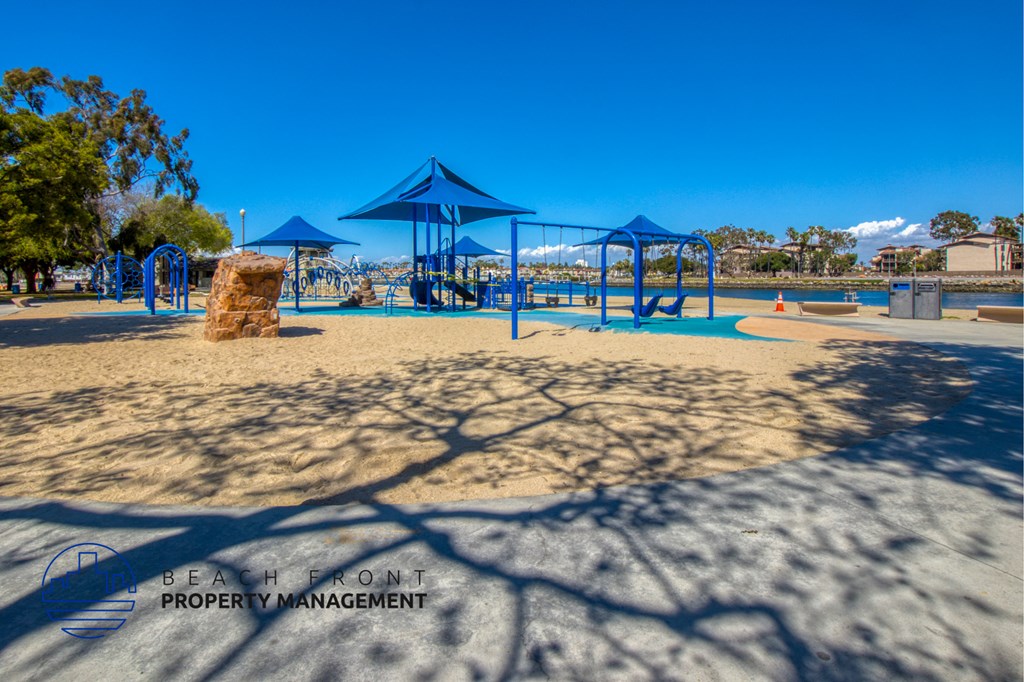 a playground at a park with shade structures