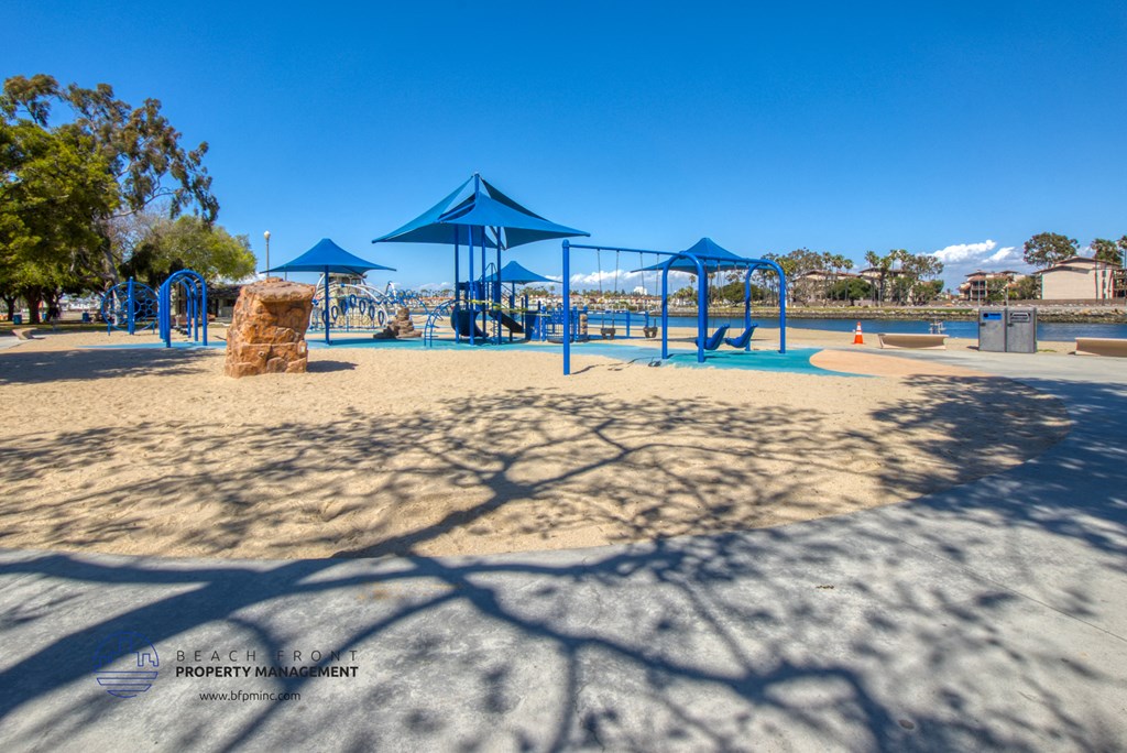 a playground at a park with shade structures