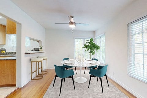 an empty dining room with a table and chairs