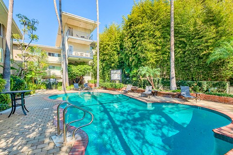 Poolside lounging at Sunset Barrington Gardens Apartment Homes