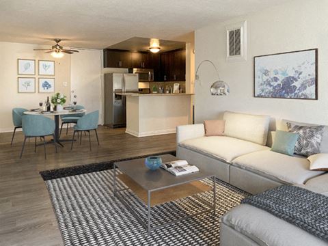 Living room, dining area, and kitchen at Mediterranean Village Apartment Homes