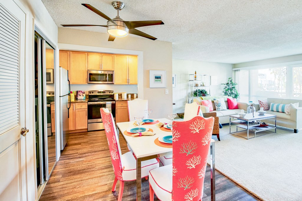 a dining room with a table and chairs