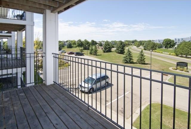 a truck is parked on a balcony overlooking a parking lot