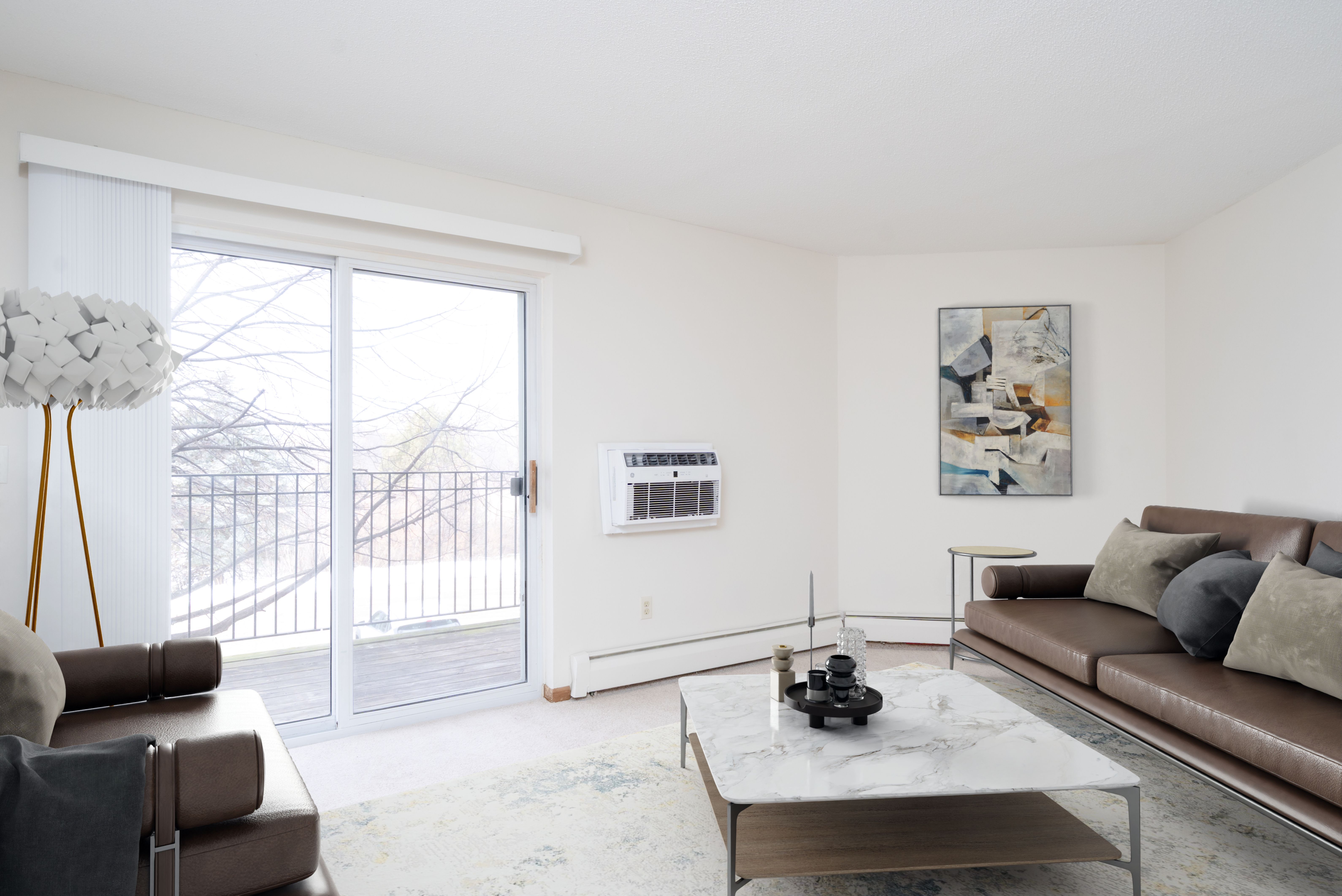 A living room with a couch, coffee table, and a painting on the wall.