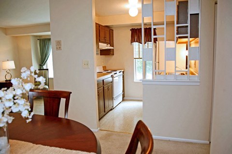 A dining room with a table and chairs is shown.