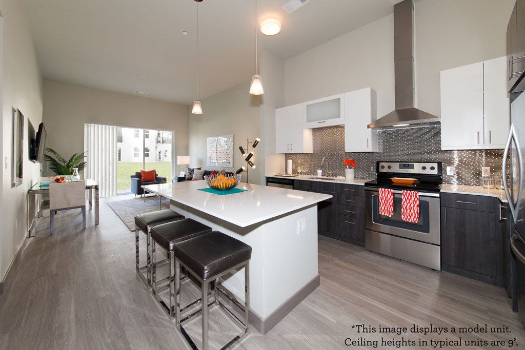 Modern kitchen with Separate Breakfast Bar at The Tremont, Burlington, Massachusetts